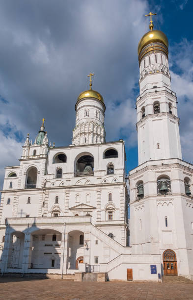 istock Ivan the Great Bell Tower, with Assumption Belfry on the right in Moscow Kremlin. Blue sky background with sunbeams 1476966968