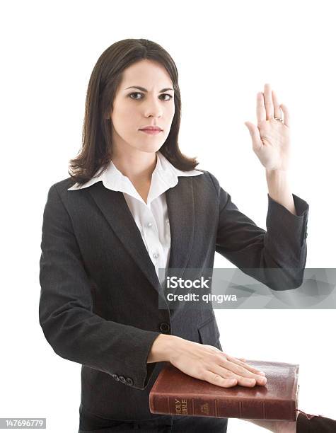 Caucasian Woman Swearing On A Bible Isolated White Background Stock Photo - Download Image Now