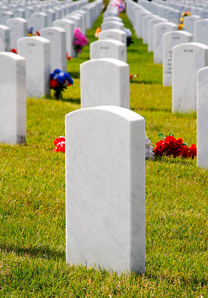 istock Military Cemetery Headstones & Flowers 147697122