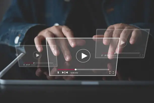 Photo of Video marketing concept. Woman playing video content online streaming, running short clip on digital tablet. Marketing technology and advertising for  online business, internet network