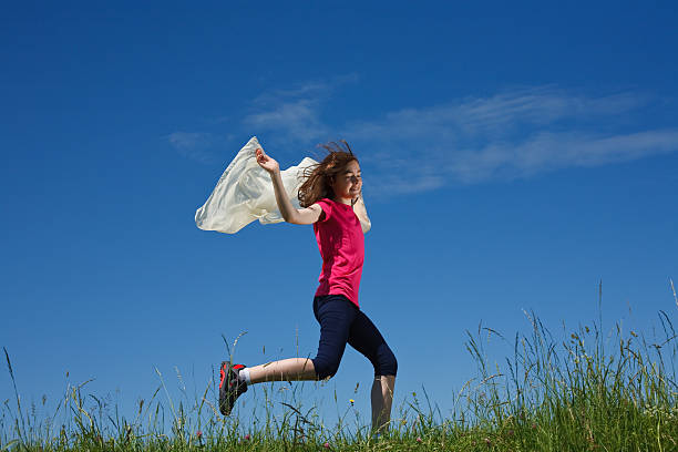 istock Girl running outdoor 147697366