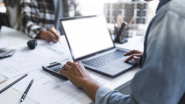 istock Image of engineer meeting for architectural project. working with laptop and engineering tools on workplace 1476974044
