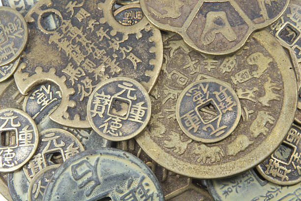 Ancient Chinese Coins Ancient Chinese Coins Scattered To Look like a Background chinese yuan coin stock pictures, royalty-free photos & images