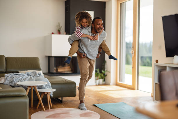istock Father Carrying His Son On The Shoulders While Laughing 1476976902