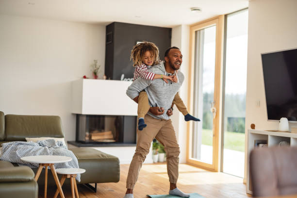 istock Father Carrying His Son On The Shoulders While Laughing 1476976925