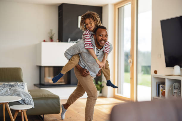 istock Father Carrying His Son On The Shoulders While Laughing 1476976935