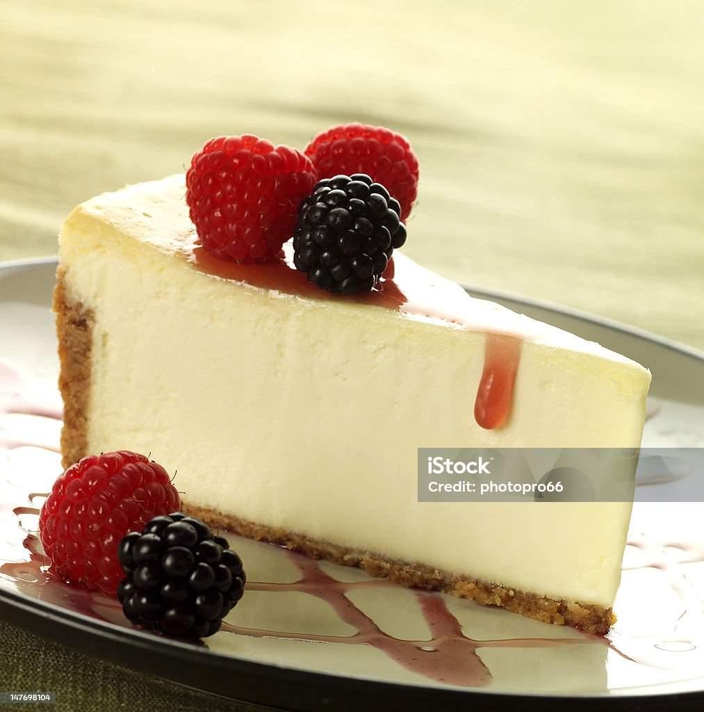 Delicious cheesecake slice with raspberries and blackberries Cheese Cake on plate Berry Fruit Stock Photo