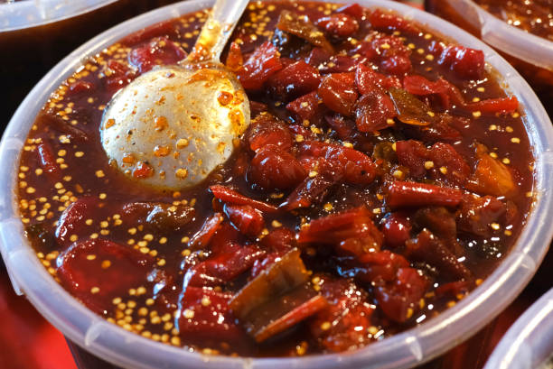 istock Indian home made spicy pickle background, Marinated food. 1476982332