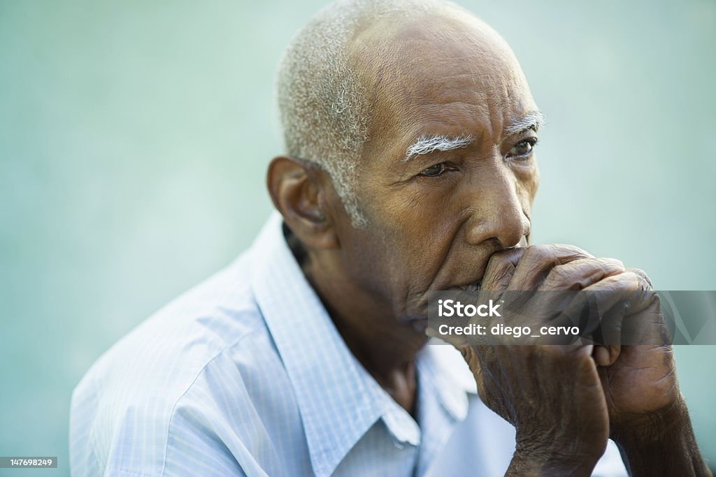 Portrait of sad bald senior man Seniors portrait of contemplative old african american man looking away. Copy space Senior Adult Stock Photo
