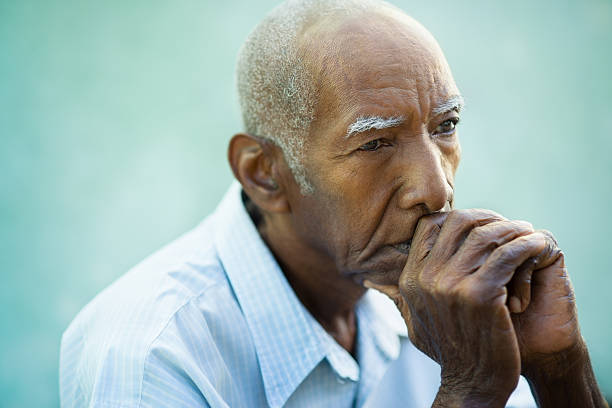 Portrait of sad bald senior man Seniors portrait of contemplative old african american man looking away. Copy space old man depressed stock pictures, royalty-free photos & images