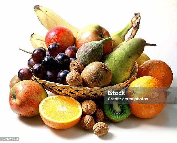 Arrangement Of Fruit In And Out Of Wooden Basket Stock Photo - Download Image Now - Fruit Bowl, Basket, Nut - Food