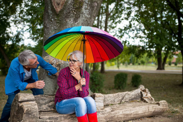 istock Couple walking in wet day 1476983813