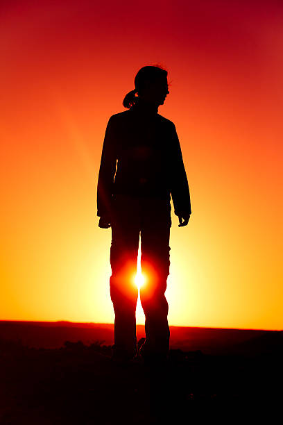 istock Woman Standing as Silhouette 147698416