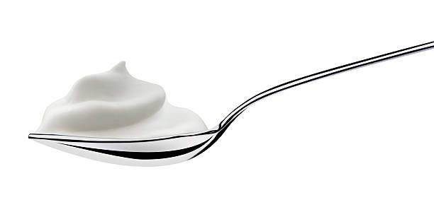 istock spoon of milk cream 147698557