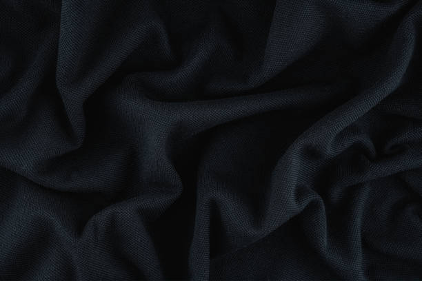 istock Black texture background detail of fabric textile material canvas. 1476989594