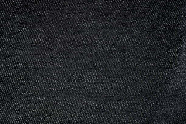 istock Black texture background detail of fabric textile material canvas. 1476989782