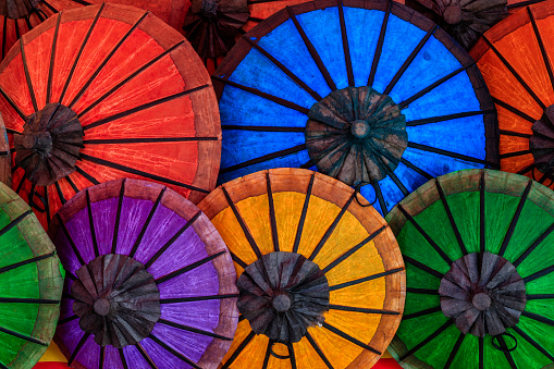 Umbrella beach. Red summer beach parasol on blue sea background. Sun sunshade for vacation travel. Outdoor relax holiday at ocean with copy space