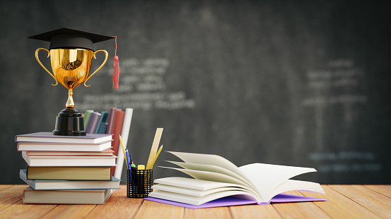 graduation hat with golden trophy on wood table with blackboard background. 3D illustration rendering