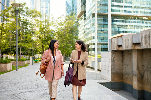 istock Corporate professionals walking outdoors in office park 1477001222