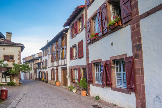 Old houses with shutters in the historic central street of Saint-Jean-Pied-de-Port stock photo