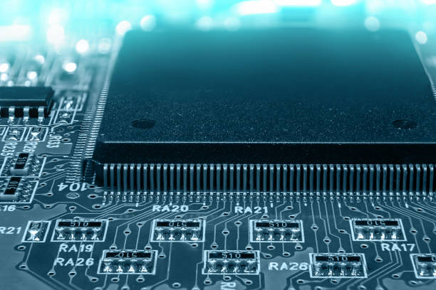 istock Closeup of Printed Circuit Board with processor, integrated circuits and many other surface mounted passive electrical components. 1477011892
