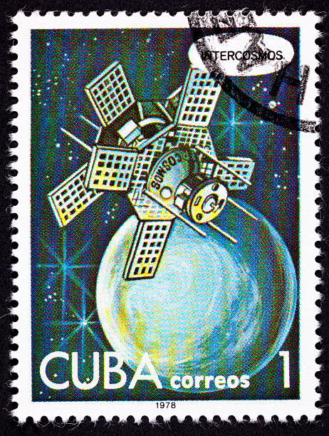 istock Canceled Cuban Postage Stamp Intercosmos Satellite Orbiting Planet in Space 147701249