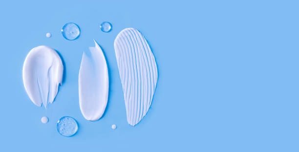istock cosmetic smears cream texture on blue background 1477014358