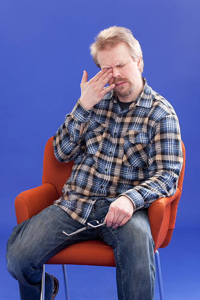 istock Tired Man Sitting On A Chair 147701500