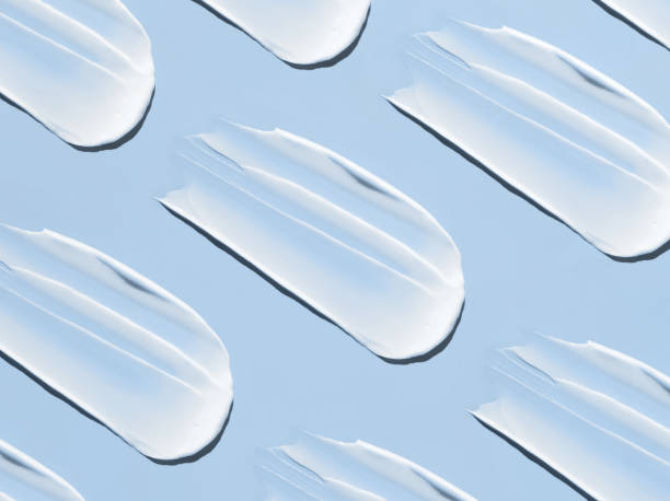 istock pattern cosmetic smears cream texture on pastel blue background 1477018668