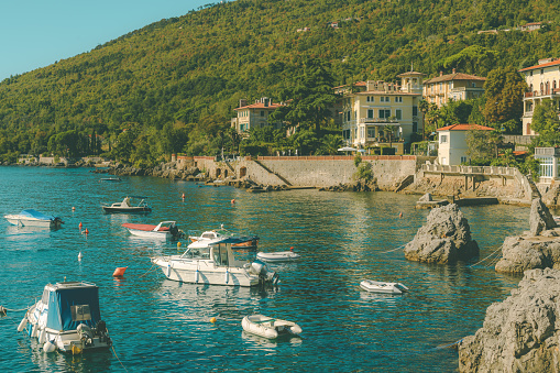 Small boats moored in Lovran marina in Kvarner gulf on sunny summer day