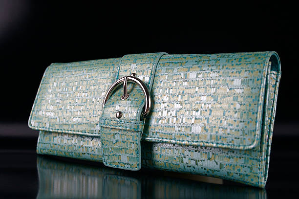 istock Teal Handbag on Shiny Black Background 147702436