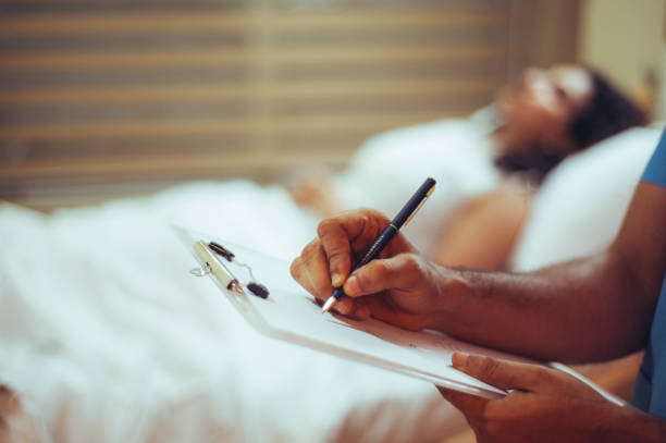 istock Doctor writing a report on a report card 1477026847