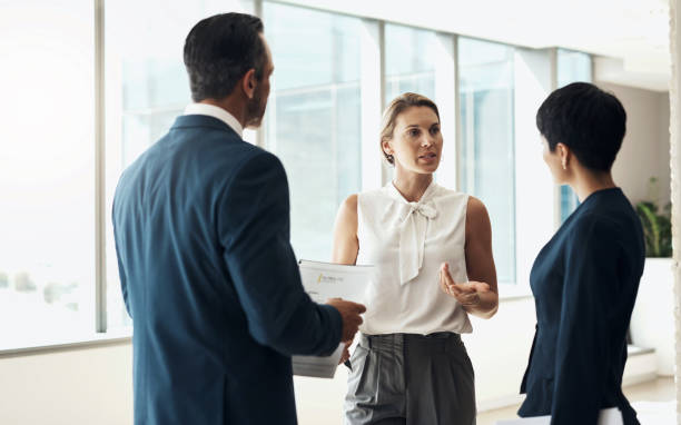 istock Collaboration, office or business people talking in meeting planning a group project together with teamwork. Strategy ideas, corporate or workers in conversation working on our vision or sales goals 1477032947
