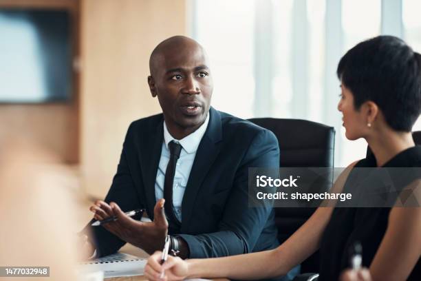 Black Man Leadership And Corporate Meeting In Office With Executive Management Investor Feedback And Strategy Professional Business Manager Team Discussion And Ceo In Financial Investment Seminar Stock Photo - Download Image Now