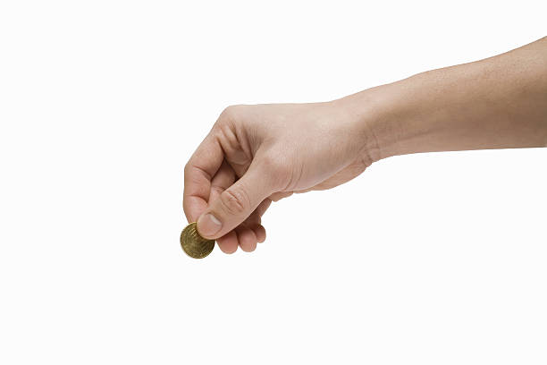 istock A hand with a European coin in its hand 147703987