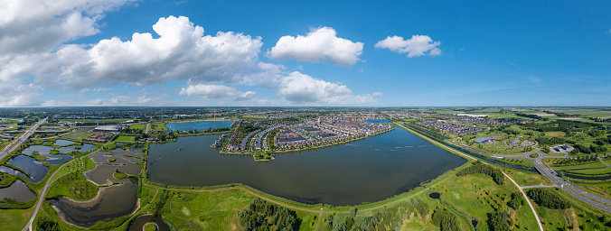 Aerial view, panorama picture with park Van Luna and district Stad van de Zon, City of the Sun in Heerhugowaard. Province of North Holland in the Netherlands