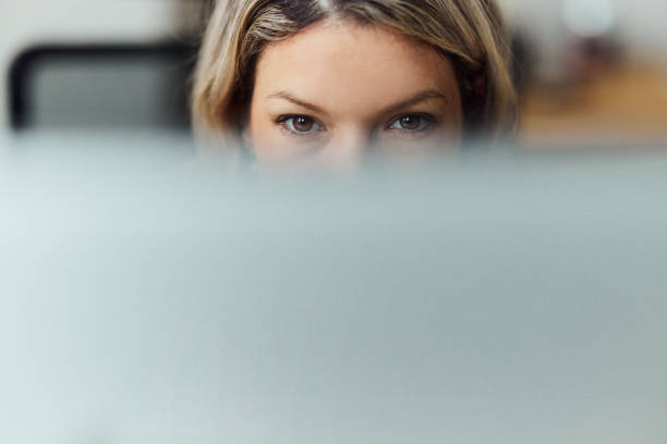 istock Close up of a concentrated woman working on computer. 1477040519