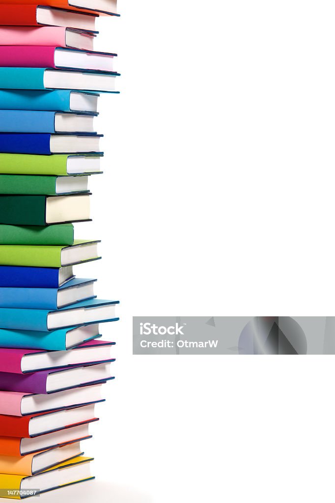 Stack of colorful books left border Stack of colorful real books on white background, partial view. Book Stock Photo