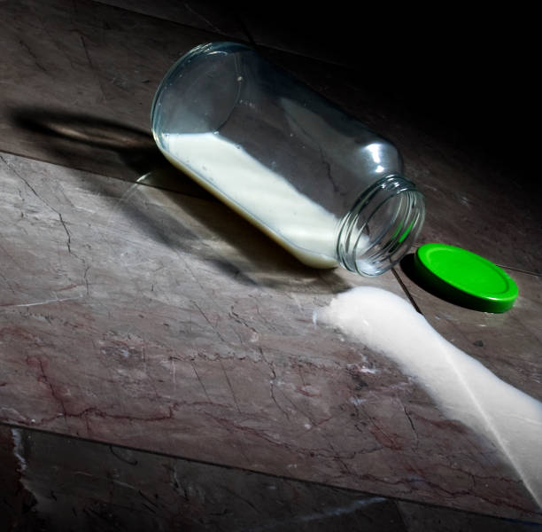 istock Glass of Spilled Milk 147704198