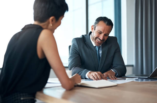 istock Clients meeting, business man and documents for contract proposal, negotiation strategy or professional consultant advice. Paperwork of corporate people in b2b conference, information and discussion 1477043843