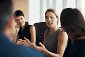 Business woman, mentor meeting and leader of corporate conversation, collaboration and feedback. Female manager, team discussion and company seminar in workshop, executive planning and group strategy
