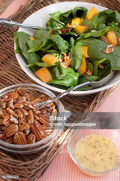 Spinach Salad With Pecans Peaches And Dressing Stock Photo - Download Image Now - Day, Food, Freshness