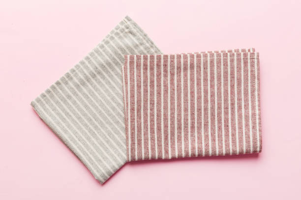istock top view with red empty kitchen napkin isolated on table background. Folded cloth for mockup with copy space, Flat lay. Minimal style 1477044451