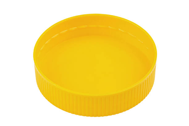 istock Yellow plastic lid isolated on white background. Plastic round jar lid. 1477044872