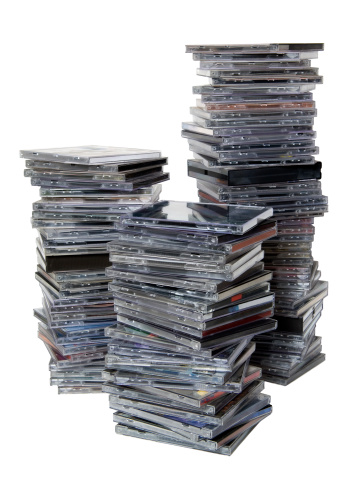 3 stacks of CDs on white background, there are approximately 100 cds.
