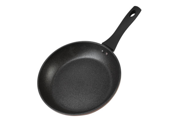 istock Black frying pan with nonstick surface isolated on white background, close-up. 1477045857