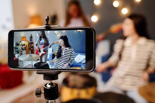 istock Girls recording their performance on smartphone 1477049758