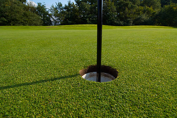 golf course hole on green stock photo