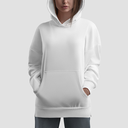 Mockup of white long hoodie on girl with hands in pockets, shirt with side slits, clothes isolated on background, front. Casual clothing template, trendy sweatshirt for design, branding, advertising