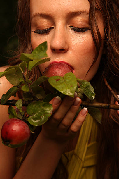 woman eating apple stock photo